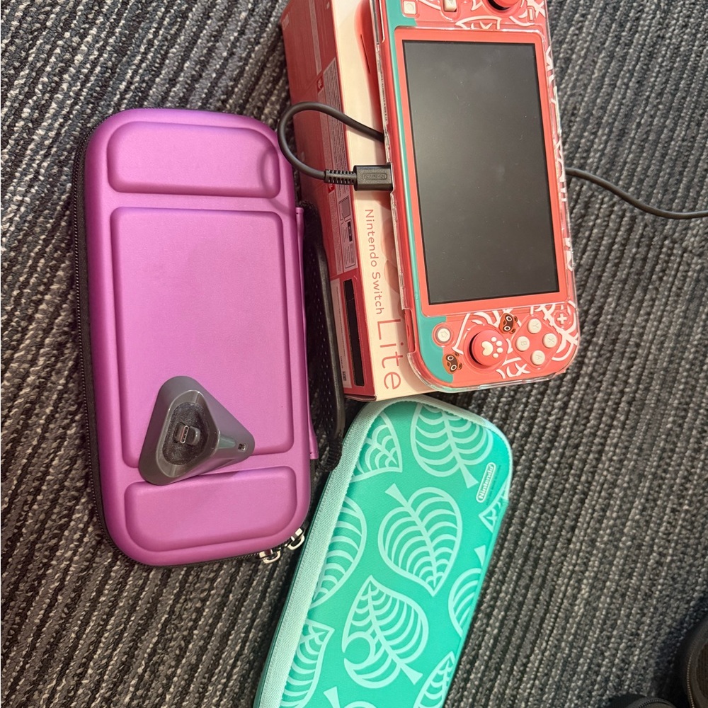 Nintendo Switch Lite with Coral Console and Colorful Cases